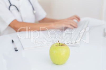 Apple in doctor desk