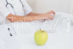 Apple in doctor desk