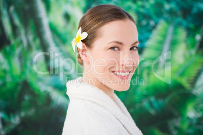 A beauitful young woman with a flower in her hair