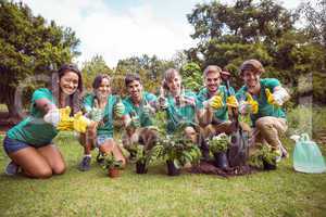 Happy friends gardening for the community