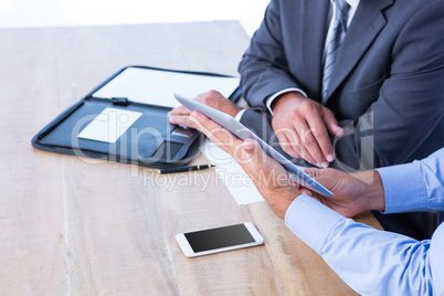 Business people using digital tablet