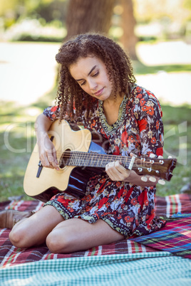 happy girl playing guitar