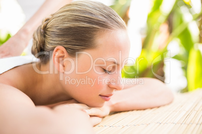 Attractive woman getting massage on her back