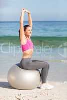 Fit woman doing fitness on exercise ball