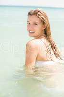 Happy pretty blonde bathing into the sea