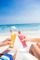 Couple toasting together at the beach