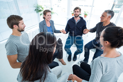 Group therapy in session sitting in a circle