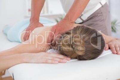 Physiotherapist doing back massage