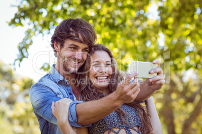 Hipster couple taking a selfie