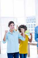 Happy creative businesswoman cheering  together