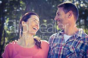 Happy couple smilling in park