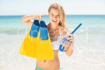 Happy pretty blonde holding mask, scuba and fins