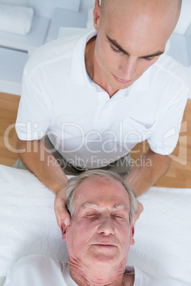 Man receiving neck massage