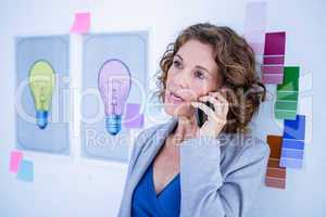 Creative businesswoman having phone call