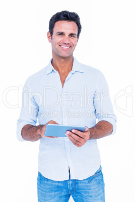 Handsome man using his tablet computer