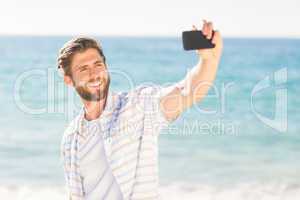 Happy man taking selfie