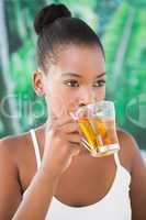 Close up portrait of a beautiful young woman drinking a tea