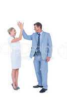 businessman and businesswoman greeting each other