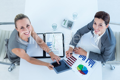 Smiling businesswomen working together