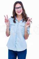 Pretty geeky hipster making peace sign