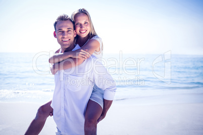 Happy couple having fun on the beach
