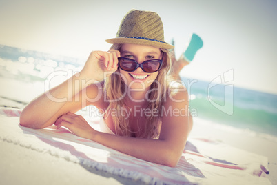 Beautiful woman sitting on the towel