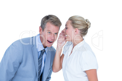 Businessman telling secret to a businesswoman
