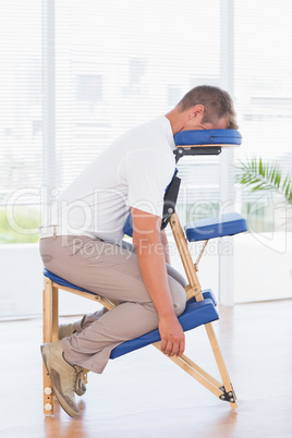 Man in a massage chair