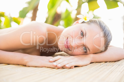 Peaceful blonde lying on massage table