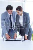 Business people checking file
