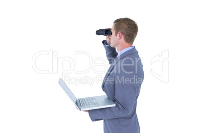 Businessman using binoculars