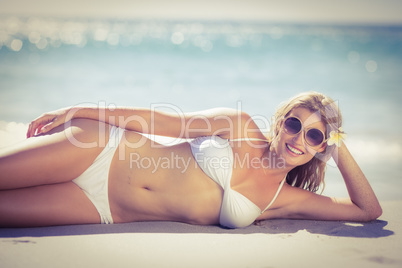 Relaxed pretty woman lying on the beach