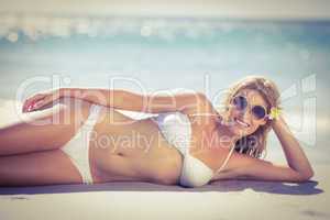 Relaxed pretty woman lying on the beach