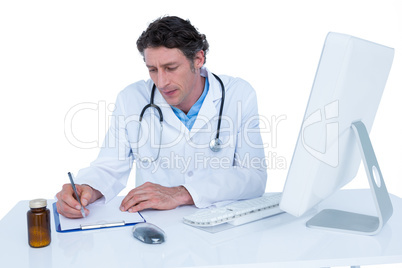 Doctor writing on a notebook