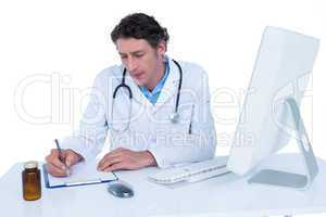 Doctor writing on a notebook