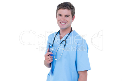 Young nurse in blue tunic smiling at the camera