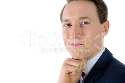 Thoughtful businessman looking at camera Thoughtful businessman looking at camera