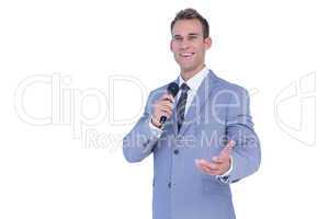 Happy businessman speaking with micro
