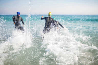Swimmers running in the ocean