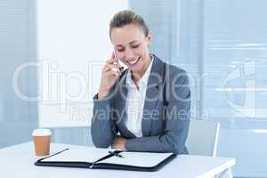 Smiling businesswoman having phone call