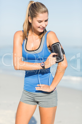 Portrait of beautiful fit woman using her phone