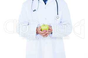 Doctor holding green apple