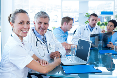 Team of doctors working on their files