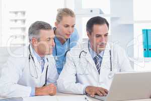 Doctors and nurse working with computer