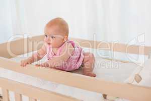 Beautiful cute baby girl in her bed