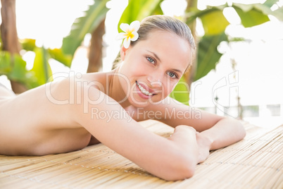 Peaceful blonde lying on towel