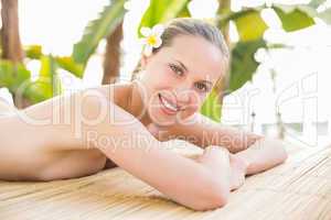 Peaceful blonde lying on towel