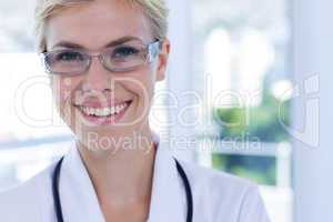 Close up view of happy female doctor looking at camera