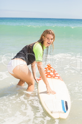 Happy pretty blonde preparing to surf