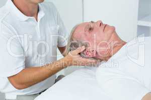 Man receiving neck massage